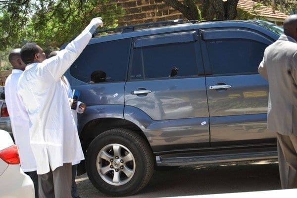 PHOTO | ANTHONY OMUYA Forensic experts at Kilimani Police Station inspect the car belonging to Bungoma Senator-elect Moses Wetangula that was reportedly shot at along Ngong Road. Mr Wetang'ula's driver has recanted an earlier statement that gunmen shot at the politician on Thursday last week, according to a police report.