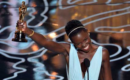 Actress Lupita Nyong'o accepts the Best Performance by an Actress in a Supporting Role award for '12 Years a Slave' onstage during the Oscars at the Dolby Theatre on March 2, 2014 in Hollywood, California. PHOTO/AFP