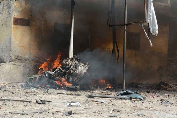 The aftermath of an attack on a government convoy in Mogadishu on May 5, 2013. Somali MP Isak Mohamed was killed and another wounded on Monday after a car bomb exploded. AFP PHOTO/ FILE