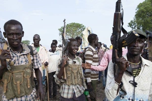 Members of the White Army, a South Sudanese anti-government militia, attend a rally in Nasir on April 14, 2014. South Sudan's President Salva Kiir sacked his army chief on Wednesday after rebels seized a major oil hub, unleashing two days of ethnic slaughter in which the UN says hundreds of civilians were massacred. AFP PHOTO / ZACHARIAS ABUBEKER