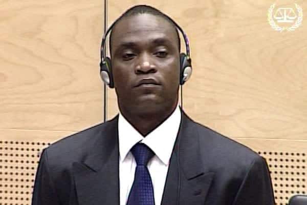 Picture released by the International Criminal court press office on June 27, 2008 showing Congolese militiaman Germain Katanga standing up as he  listens during his pre-trial evaluation hearing.   AFP PHOTO