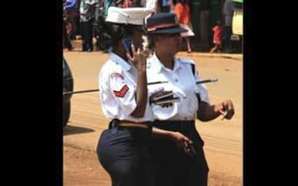  Corporal Linda Okello (left) has been at the centre of public debate after this picture of her in a tight skirt at a KCB rally ran in a newspaper. FILE 
