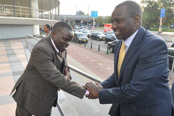 Deputy President William Ruto (right) and former radio presenter Joshua arap Sang outside the ICC in The Hague. Ruto Sunday night flew to The Hague in readiness for testimonies by nine witnesses. PHOTO | FILE