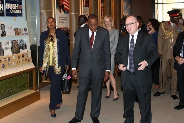 President Uhuru Kenyatta (centre) and Foreign Affairs Cabinet Secretary Amina Mohamed (left) during a tour of the George W. Bush Presidential Library in Dallas, Texas, on August 9, 2014. With him is the museum's director, Allan Lowe. PHOTO | PSCU