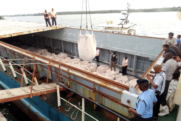 Port workers, security officers and crew members supervise the offloading of cargo suspected to be drugs from the vessel MV Al Noor (B. Bushehr Amin Darya) at the port of Mombasa on July 3, 2014. PHOTO | LABAN WALLOGA.   