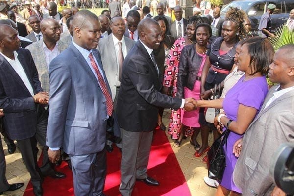 Deputy President William Ruto is introduced to Uasin Gishu nominated Member of County Assembly Rose Kisama by Governor Jackson Mandago in Eldoret on September 19, 2014.