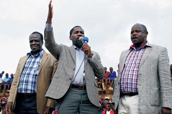 From left, Kakamega Governor Wycliffe Oparanya, Meru’s Peter Munya and Isaac Ruto of Bomet address residents of Muthara in Tigania East Sub County, Meru County on September 5, 2014. PHOTO | PHOEBE OKALL