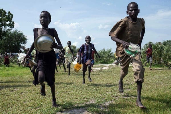 Children run to a food drop-off point in Leer, South Sudan. War-torn South Sudan has banned the employment of all foreign workers, including those with non-governmental organisations, and ordered they be replaced by locals. PHOTO | AFP | NICHOLE SOBECKI
