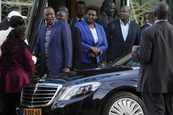 Uhuru Kenyatta meets Kenyans after his arrival at Schiphol Airport in Amsterdam on October 7, 2014. PHOTO | JOAN PERERUAN
