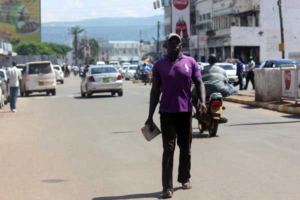 Amunga walks in the streets of Kisumu. PHOTO |