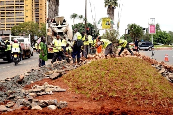 Workers spruce up a section of Uhuru Highway on