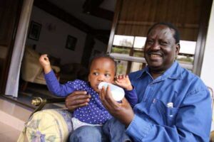 Cord co-principal Raila Odinga with granddaughter Senayi Akowi at his Karen home on August 1, 2015. Mr Odinga said the visiting US president would not have lauded the Jubilee administration’s efforts had he stayed longer to hear of the loss of billions of shillings in government reported by Auditor-General Edward Ouko. PHOTO | WILLIAM OERI | NATION MEDIA GROUP 