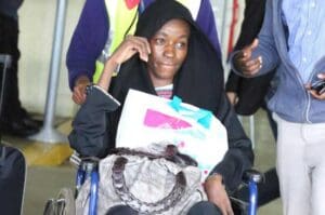 Rosebella Akoth is wheeled out of the Jomo Kenyatta International Airport lounge on arrival from Saudi Arabia where she was working as a house girl. (PHOTO: MOSES OMUSULA/ STANDARD)