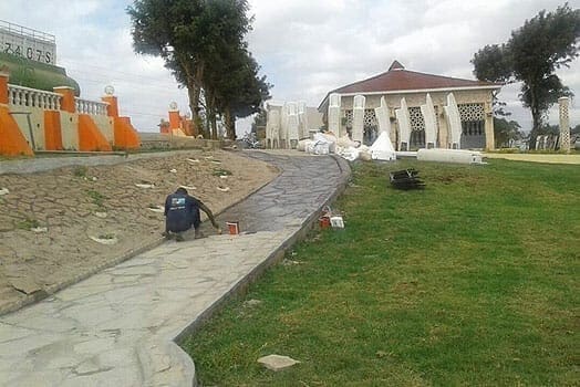 Workers spruce up the home ahead of Saumu's graduation party. PHOTO | COURTESY
