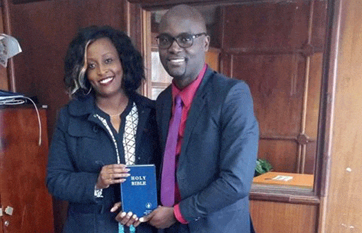 President of Atheists in Kenya, Harrison Mumia (right) receives a Bible from Ms Caroline Njuguna. The photo posted online by NTV’s Larry Madowo. PHOTO | COURTESY