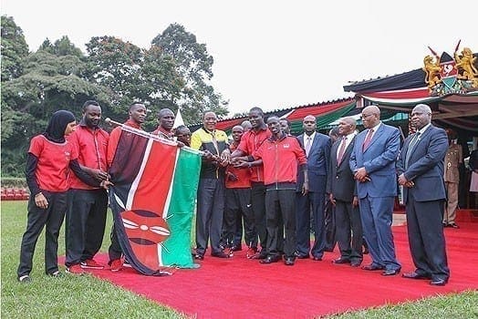 President Uhuru Kenyatta with members of the Kenyan team who will take part in the 2016 Olympics games in Rio de Janeiro. PHOTO | PSCU
