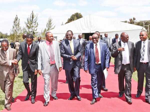 Deputy President William Ruto accompanied with CS Mwangi Kiunjuri (2nd left, red tie) and some of the governors during meeting of IBEC at his Karen office last week. PHOTOS / DANIEL