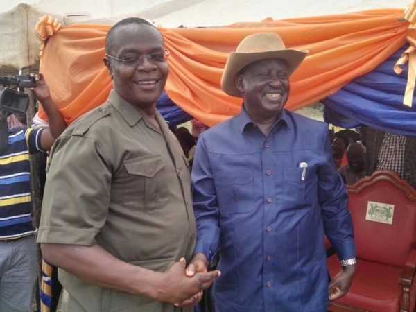 Funyula MP Paul Otuoma with Cord leader Raila Odinga on Saturday. /COURTESY
