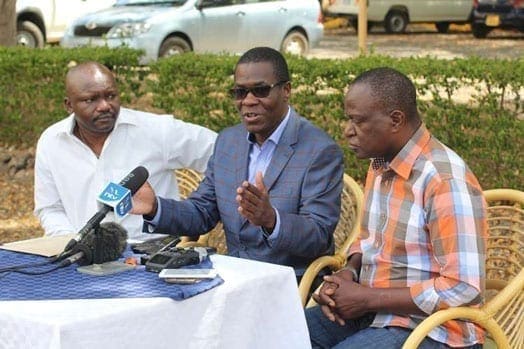 Ugunja MP Opiyo Wandayi (centre) gestures as he speaks to the media flanked by Nyando MP Fred Outa (right) and aspirant for Kisumu Town Richard Ogendo in Kisumu. PHOTO | TOM OTIENO