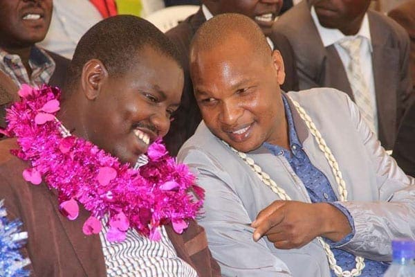 Deputy President William Ruto's top aide, Mr Farouk Kibet (right), with Uasin Gishu Governor Jackson Mandago at a past event. Mr Kibet received Sh1.5 million from Josephine Kabura Irungu, the woman named as a key suspect in the looting of the National Youth Service. PHOTO | FILE | NATION MEDIA GROUP