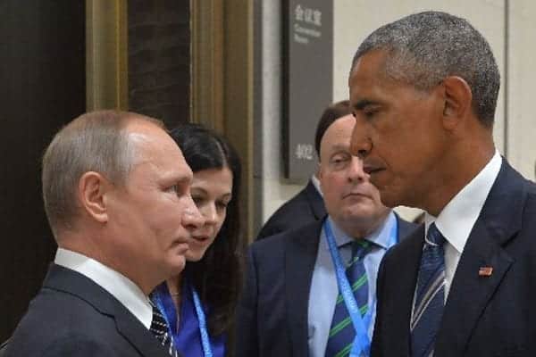 Russian President Vladimir Putin (left) meets