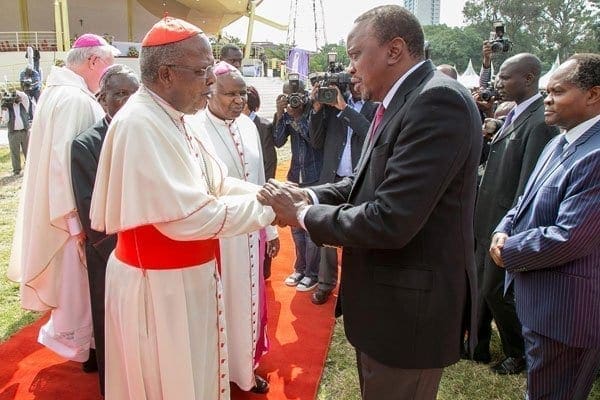 Catholic Archbishop John Cardinal Njue (left) with President Uhuru Kenyatta at the University of Nairobi on February 25, 2017. PHOTO | EVANS HABIL | NATION MEDIA GROUP