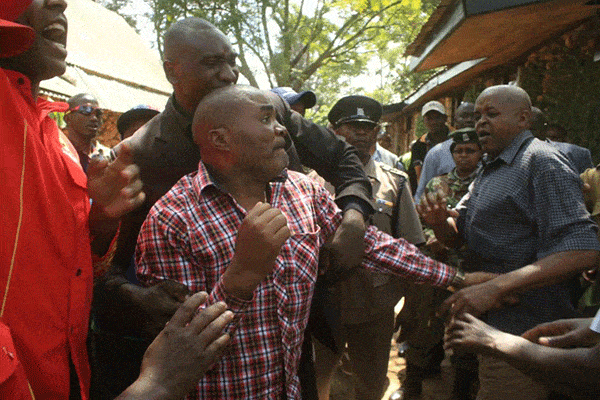 Security officers restrain Gitugi Ward Jubilee