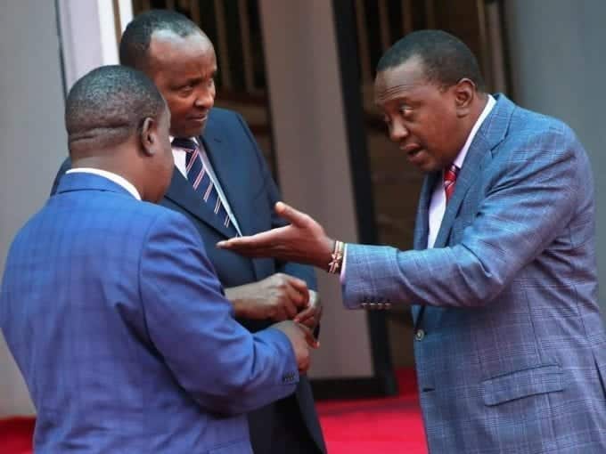 President Kenyatta with Interior CS Fred Matiang’i and MP-elect Aden Duale at Harambee House yesterday / HEZRON NJOROGE