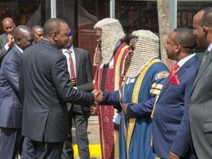 President Uhuru Kenyatta greets Senate Speaker Kenneth Lusaka ahead of the official opening of the 12th Parliament on Tuesday, September 12, 2017. /PSCU