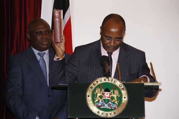 Francis Kimemia takes his oath of office as Secretary to the Cabinet at State House, Nairobi. PHOTO | PSCU | FILE
