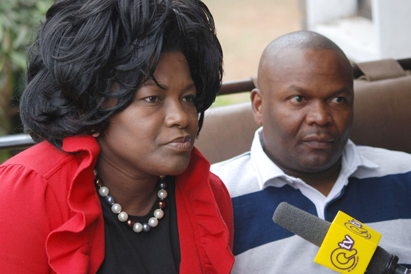 PHOTO | FILE Nairobi County Women Representative Rachel Shebesh (left) talks about her health on September 08, 2013, two days after a scuffle with the Nairobi County governor Evans Kidero. Looking on is her husband Frank Shebesh. Mrs Shebesh has declined an out of court settlement on the case.