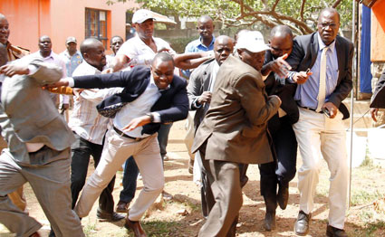 ODM Executive Director Oduor Ong’wen (centre) is harassed by irate youths who stormed Orange House on April 5, 2017