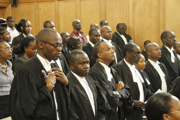 Lawyers stand to pay their respect to the Supreme Court judges during the ruling on Digital migration on March 28, 2014. The presiding judges ruled that the Analogue will remain till September 2014 and ruled the cancellation of the current digital licenses. Photo/JEFF ANGOTE
