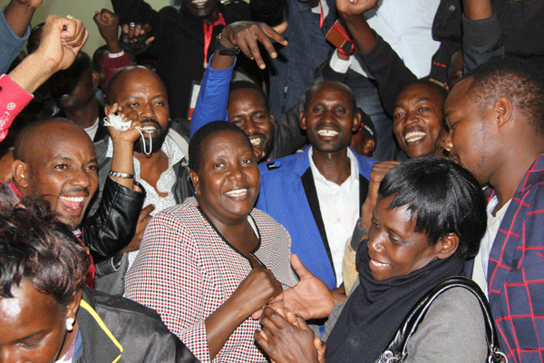 Peris Tobiko and her supporters celebrate in