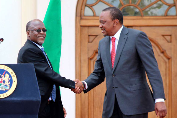 Tanzania President John Magufuli (left) and his Kenyan counterpart Uhuru Kenyatta