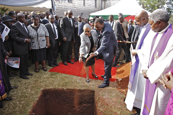 President Uhuru Kenyatta and First Lady Margaret Kenyatta at the funeral of former Juja MP and joint government chief whip George Thuo on November 22, 2013. PHOTO | PSCU