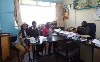 Laviniah Karanja (L) together with Ms Baines Wambui (3rd L), a director at Project1917 at Ruthagati Secondary School in Karatina, Nyeri County. Next to her is Charles Mwangi, a beneficiary of the Project. On the right is the school's principal Mr Maina Wachira. PHOTO/STELLAR MURUMBA.