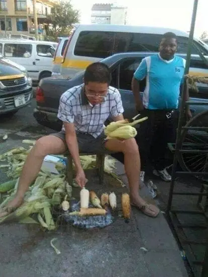 Chinese Man Roasting Maize in Nairobi streets