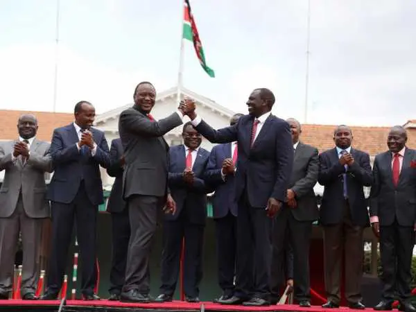 President Uhuru Kenyatta and his deputy William Ruto after they announced the offi cial merger of a dozen political parties into the Jubilee Alliance Party. PHOTOS / HEZRON