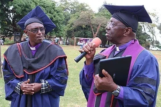 The Principal of Dr Milendas Holiness Theological Bible College, Nkaabu Mwenda (left) together with Bishop Waverly Jackson from USA at the institution on July 31, 2016. PHOTO | CHARLES WANYORO