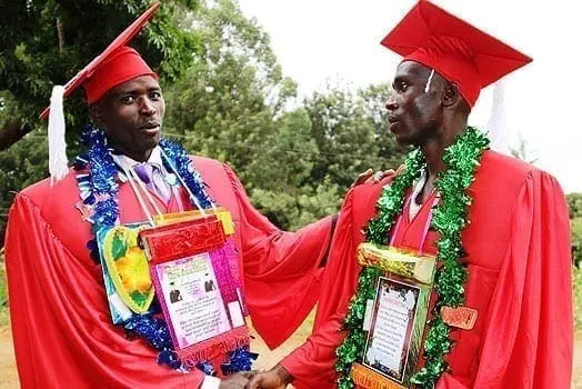Newly graduated pastors Phineas Murithi (left) and Martin Mutugi congratulate each other after they were awarded diplomas from Dr Milendas Holiness Theological Bible College on July 31, 2016. PHOTO | CHARLES WANYORO