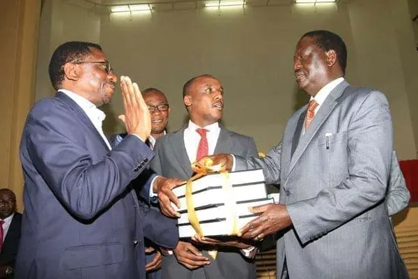 CORD leader Raila Odinga (right) receives report on electoral reforms from joint select committee members Mutula Kilonzo Junior (centre), James Orengo (left) and Eseli Simiyu at Ufungamano House, Nairobi, on August 23, 2016. PHOTO | JEFF ANGOTE | NATION MEDIA GROUP