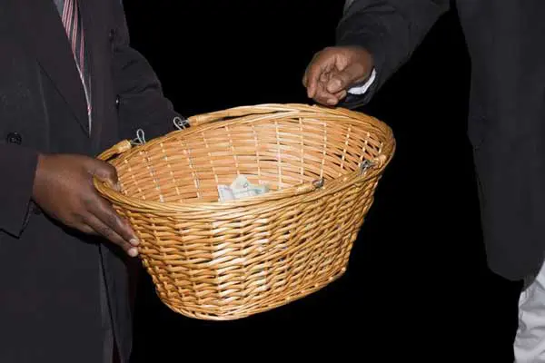 church collection basket Newly freed prisoner helps himself to church offering