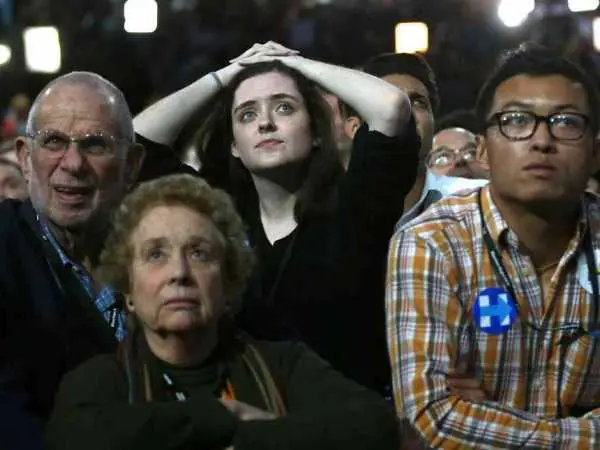 Supporters of Democratic presidential nominee Hillary Clinton Supporters of Democratic presidential nominee Hillary Clinton watch and wait at her election night rally in New York, U.S., November 8, 2016. REUTERS/Carlos Barria
