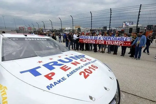 Donald Trump supporters hold a sign near the
