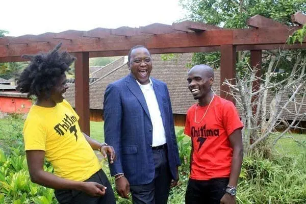 President Uhuru Kenyatta shares a light moment with William Kamore (left) and Moses Kariuki of Thitima anthem at Sagana State Lodge, Nyeri County on January 22, 2017. PHOTO | JOSEPH KANYI | NATION MEDIA GROUP