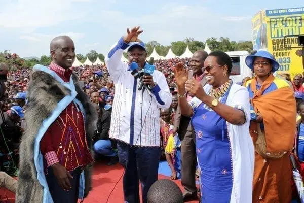 Narok West MP Patrick Ntutu (left) is welcomed to CCM party