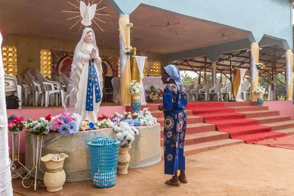 A member of the Very Holy Church of Jesus Christ of Baname arrives at the Nazareth church in Djidja on February 25, 2017. PHOTO | AFP