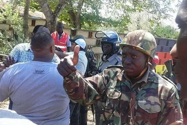 Well done... A police officer signals his