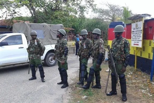 Anti-riot police officers outside the Coast